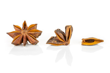 Group of one whole one quarter one piece of dry brown star anise illicium verum isolated on white background