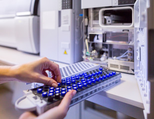 The laboratory scientist prepares samples for download to High-performance Liquid Chromatograph Mass Spectrometr. - 287761201