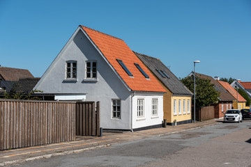 Yellow and white traditional houses in a small danish town.