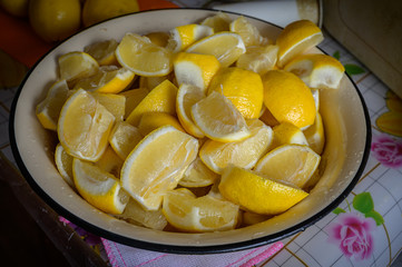 Сhopped lemons slices in home kitchen.