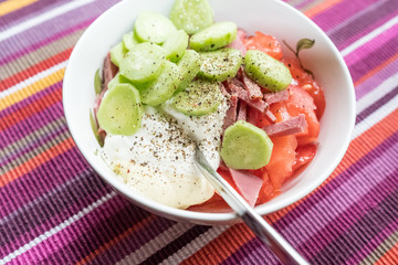 Salad of fresh cucumbers, tomatoes, beef, black pepper, sour cream, mayonnaise. Salad do not mix