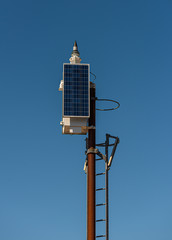 A navigational lantern equipped with solar cells.