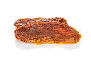 Group of two whole dried red tomato isolated on white background