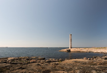 Fototapeta premium Abandoned lighthouse on a flat island.