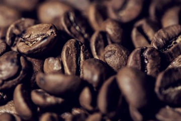 Abstract coffee beans together, close up, macro photography, dark concept