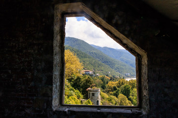 view from the old stone window on the old stone tower on the mountainside