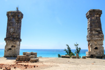 two chimneys and a stack of bricks