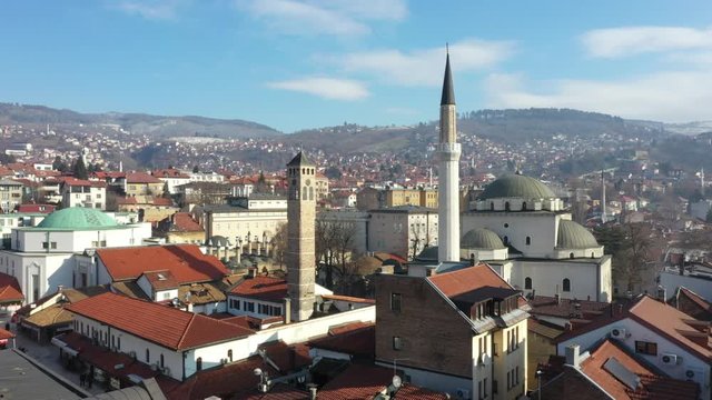 Drone shot Old watch tower and Gazi Husrev Baymosque from Ottoman period in the old part of Sarajevo Called "Bascarsija", Sarajevo, Bosnia an Herzegovina February 2019