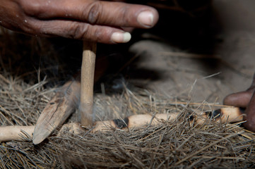 Bushman making fire in Africa