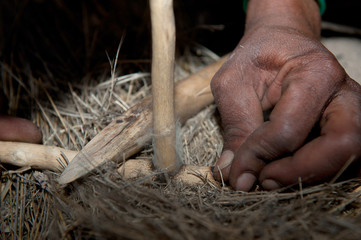 Bushman making fire in Africa