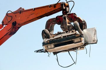 car crushing in crushing yard, destoy car, impounded, destroyed