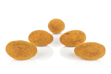 Group of five whole sweet brown chocolate cinnamon almond isolated on white background