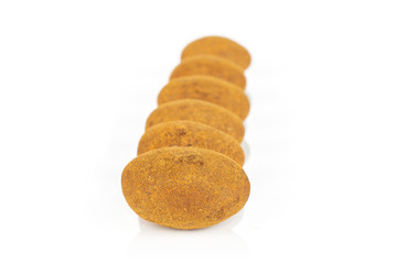 Group of six whole sweet brown chocolate cinnamon almond isolated on white background