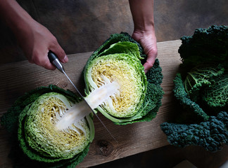 Savoy cabbage and other garden vegetables on an old board