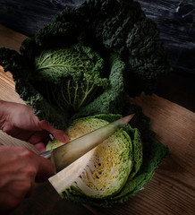 Savoy cabbage and other garden vegetables on an old board