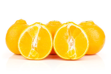 Group of three whole two halves of fresh orange tangelo minneola isolated on white background