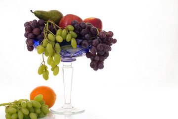 fruit in an old vase on white background