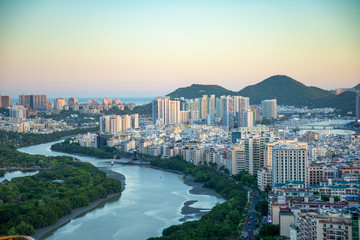 Aerial view of Sanya city with river at sunset light, Hainan province, China