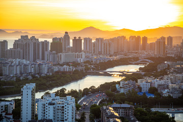 Aerial view of Sanya city with river at sunset light, Hainan province, China