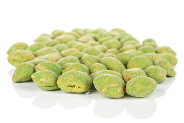 Lot of whole spicy green wasabi peanut in large group isolated on white background