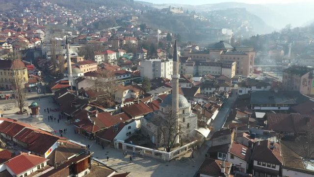 Drone shot Old watch tower and Gazi Husrev Baymosque from Ottoman period in the old part of Sarajevo Called "Bascarsija", Sarajevo, Bosnia an Herzegovina February 2019