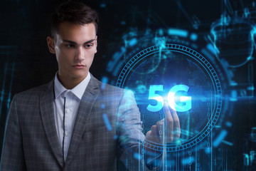 The concept of business, technology, the Internet and the network. A young entrepreneur working on a virtual screen of the future and sees the inscription: 5G