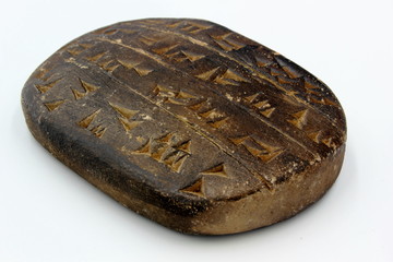 cuneiform tablet with words letters and writing on isolated on white background