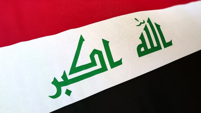 Irak national flag seamlessly waving on realistic satin texture 29.97FPS