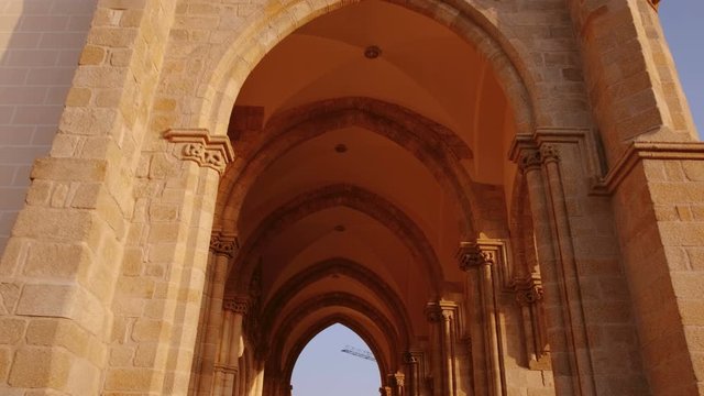 Walking towards the Chapel of Bones in Evora, Portugal. Its interior walls are covered and decorated with human skulls and bones