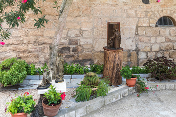 Fototapeta na wymiar Ornately decorated courtyard near the catholic Christian Transfiguration Church located on Mount Tavor near Nazareth in Israel