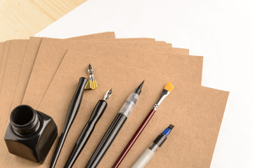 Calligraphy concept, accessories and tools for handwriting,ink, brush,writing training,blank sheets...