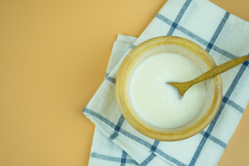 Natural yogurt in wooden cup. Yogurt is delicious tasty and healthy