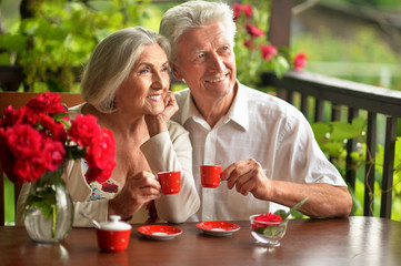 Portrait of happy senior couple drinking coffee