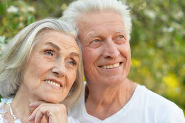 Portrait of beautiful senior couple posing in the park