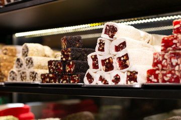 Traditional delicious turkish desserts in the shop window showcase. Different kinds of turkish delights. Popular souvenirs and snacks from Turkey.