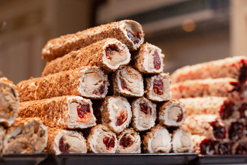 Traditional delicious turkish desserts in the shop window showcase. Different kinds of turkish delights. Popular souvenirs and snacks from Turkey.