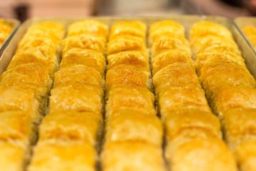 Cooking of traditional delicious turkish dessert baklava with honey. Popular snack from Turkey.