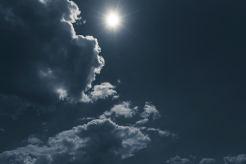 dark sky with cloudscape and sun for backgrounds
