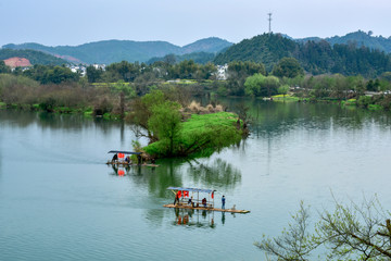Wuyuan, March 22, 2018: fishermen in Moon Bay, Wuyuan, Jiangxi, China