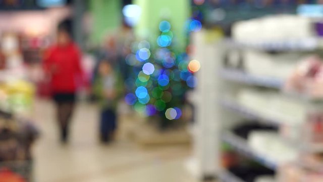 Blurred image of a crowded store or supermarket. Abstract blur and bokeh supermarket and discount store interior for background. Abstract blurred supermarket with dairy product on shelves.