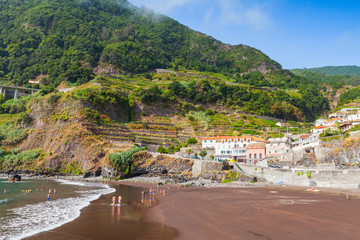 Seixal beach with resting people