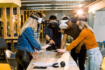 Young people having fun with the new technology vr headset goggles