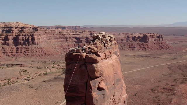 Rock Climbers Aerial Shot Valley Of The Gods Desert Canyon Orbit Left