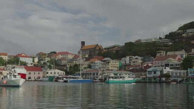 Distant boats and houses at waterfront marina / St. Georges, Grenada