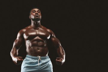Fototapeta na wymiar Athletic african man showing naked muscular body