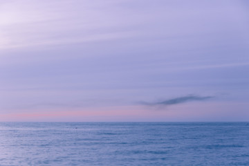 Long exposure landscape of blue sky and sea. Calm and minimalistic image.