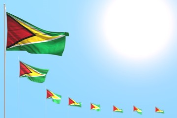 pretty national holiday flag 3d illustration. - many Guyana flags placed diagonal with soft focus and free space for your content