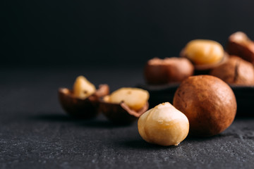 Macadamia nuts on a dark background