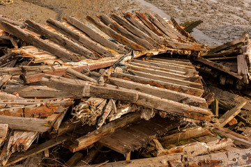 An old ship docked at the sea