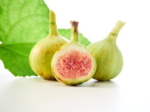 Figs fruit with leaves on white background